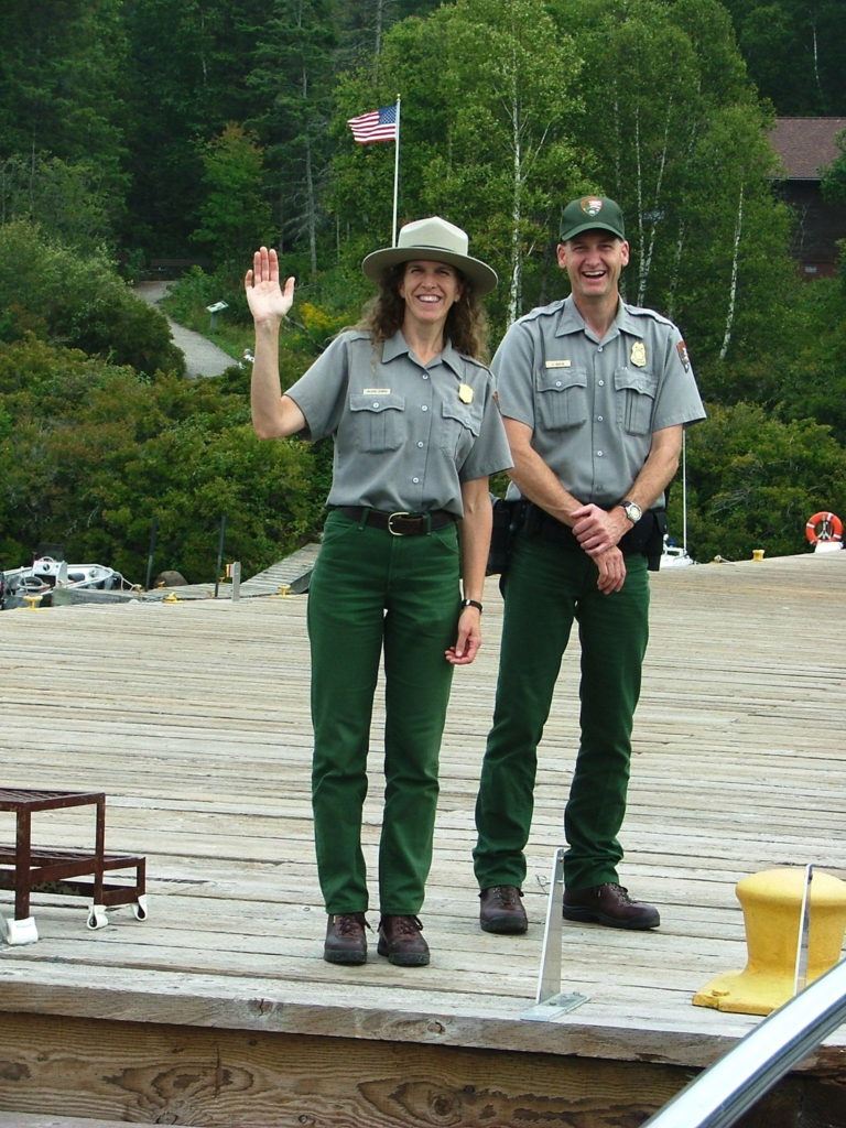 Steve and Val, 2021 Wickie Award Winners wave from the dock at Windigo Harbor.
